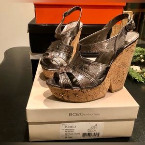 Metallic silver and cork wedge with metallic silver detail. Size 8.5.